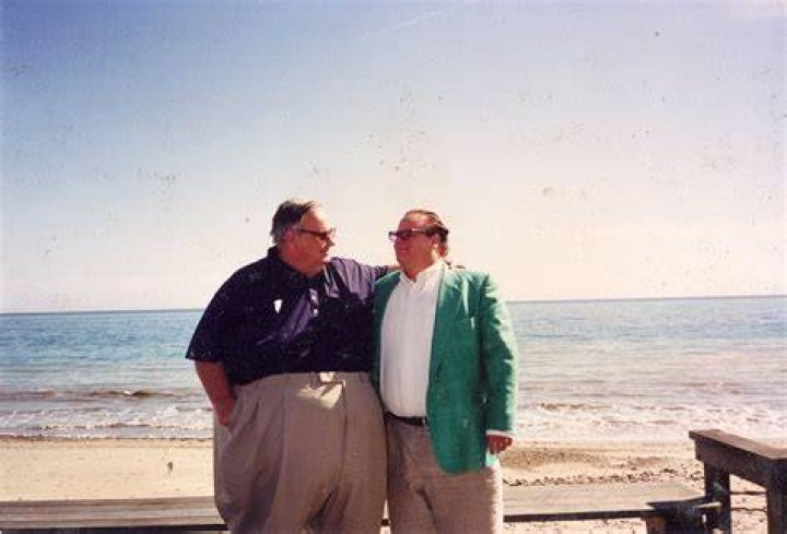 Chris Farley and his dad in the 1990&rsquo;s at a beach on Lake Michigan. r