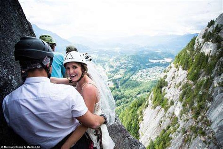 Couple climb 2,300ft to tie the knot on top of the Chief in British