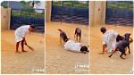 “Doberman Rottweiler”: Nigerian Lady Pranks Her Dogs & Falls, They Rush to Rescue Her in Lovely Video