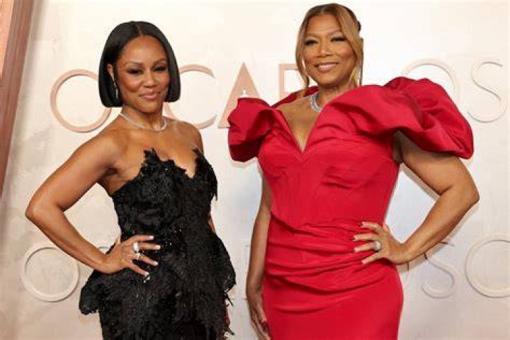 Queen Latifah and Eboni Nichols Hold Hands on Red Carpet at AmfAR